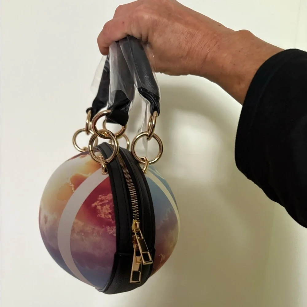 NWT-whimsical tie-dyed clouds  Pristine pebbled Rugby football purse gold chain